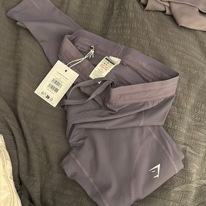 2 pairs of running leggings and crop tank. All together. Never worn.